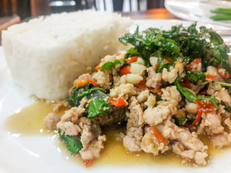 STIR FRIED CRISPY BASIL WITH PORK AND BLACK PRESERVED EGGSの写真素材