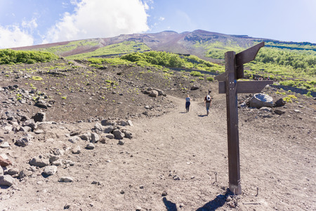 Mount Fuji, Japan. Hikers ascending Mount Fuji on a clear summer day.の写真素材