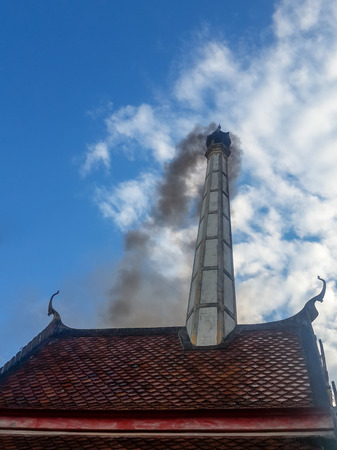A Crematory with gray cloud background in Thailand.の写真素材