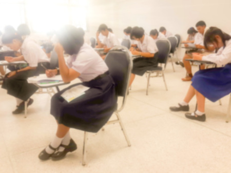 Blurry view of study chairs in classroom of university or campusの写真素材