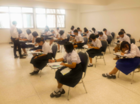 Blurry view of study chairs in classroom of university or campusの写真素材