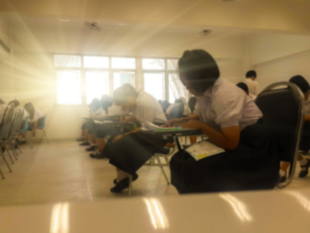 Blurry view of study chairs in classroom of university or campusの写真素材