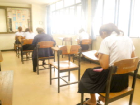 Blurry view of study chairs in classroom of university or campusの写真素材