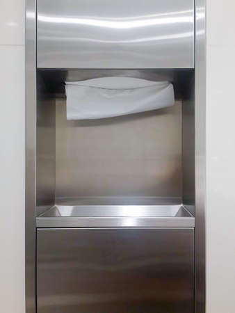 Soft focus tissues paper towel dispenser on granite wall in barthroomの写真素材