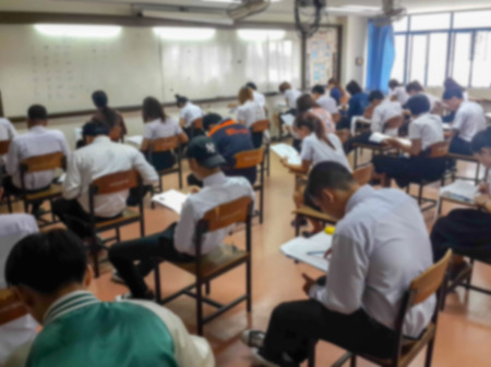 Blur abstract background of examination room with undergraduate students inside.の写真素材