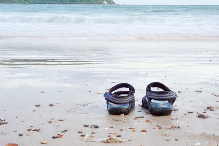 Sit on beach and take off the shoesの写真素材