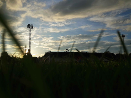 Silhouette  running on road at sunrise. Fitness and workout wellness concept.の写真素材
