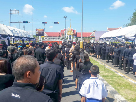 Buriram, THAILAND - October 26, 2017 : Mourners lay flowers as a sign of respect for the late Thai king Bhumibol Adulyadej in Buriram City Hall.のeditorial素材