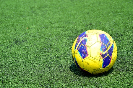 Soccer Ball on Green Fieldsの写真素材