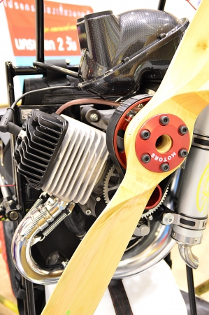 Engine part of paramotor with wheels, a motorized paraglider, flying.の写真素材