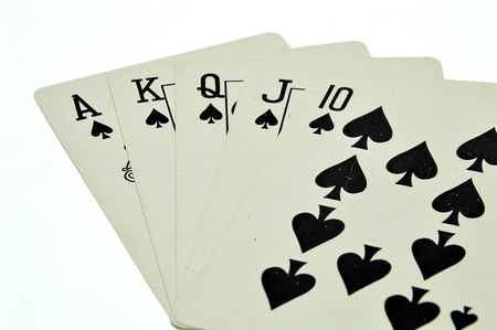 A royal straight flush playing cards poker hand isolate on white backgroundの写真素材