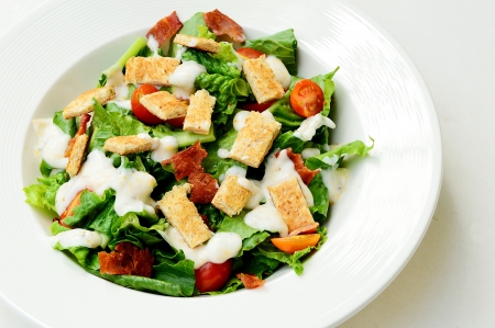 Delicious ceasar salad isolate on white backgroundの写真素材