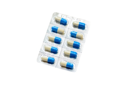 Capsules packed in blisters, isolated on whiteの写真素材