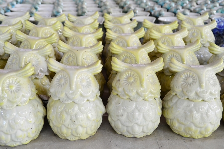 Variety of owl Ceramic Pots in an Outdoor Shopping Market.の写真素材