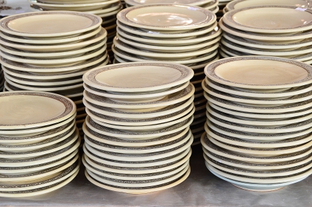 stack of ceramic plates in outdoor marketの写真素材