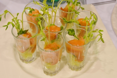fresh salmon and shrimp salad appetizer in glassの写真素材
