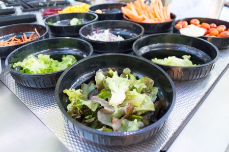 salad bar with vegetable in restaurantの写真素材