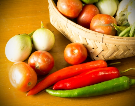 fresh vegetable with basket on wooden table still lifeの写真素材