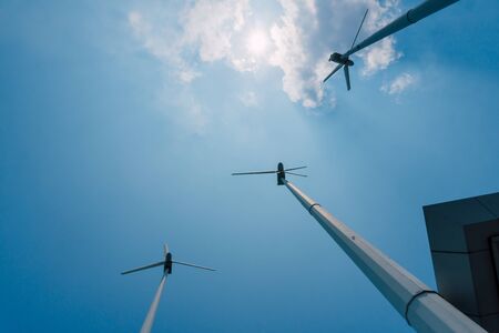 low angle shot of wind mil and blue skyの写真素材