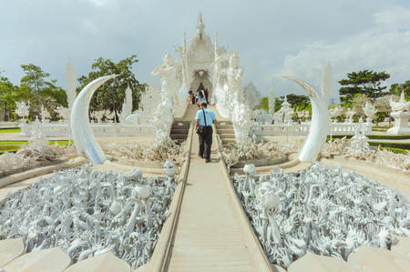 Chiang Rai, Thailand -  November 20,2012   Wat Rong Khun, beautiful scene of Wat Rong Khun or the White Temple  Traveler are sightseeing and walking in to church のeditorial素材