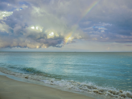 Colorful Rainbow over a tropical ocean  の写真素材
