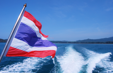 Thai flag and the sea with blue sky の写真素材