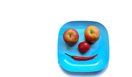 fruits and vegetables in a plateの写真素材