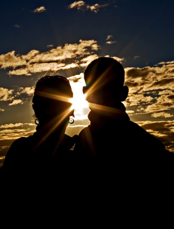 Silhouette of young couple in loveの写真素材