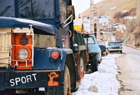 Velayat   1082;ood, Iran - December 06, 2008  The blue old truck is standing at the side of the road through a small village is situated about 5 km from Dizin  Dizin is a popular iranian ski resort  It is situated to the north of Tehran  のeditorial素材