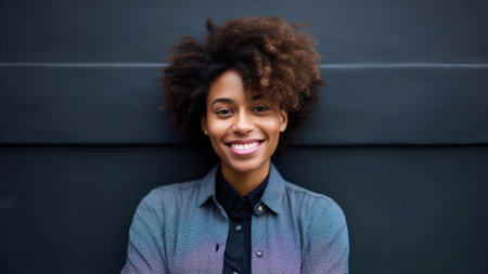 Portrait of young african american woman with afro hairstyleの素材