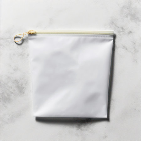Blank white paper bag on white marble background. Mockup for design.の素材