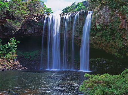 Panoramic view on mountain waterfall in summerの写真素材