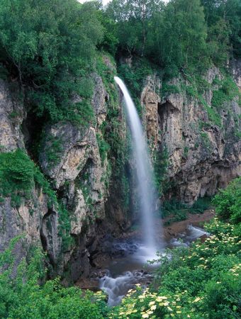 Full water mountain waterfall in summerの写真素材