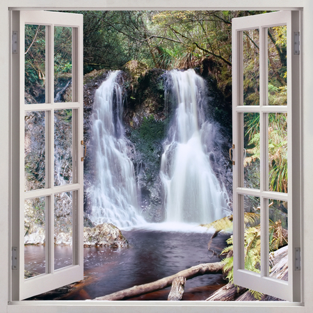 Open window view to Hogarth Falls - a pleasant little waterfall nestled in the People s Park in the quaint coastal township of Strahan,Tasmania,Australiaの写真素材