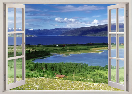 Panoramic view to river with farmland and mountains, Norwayの写真素材