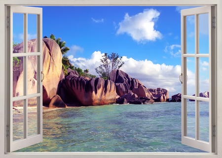 Open window view to  old stones coastline Seychellesの写真素材