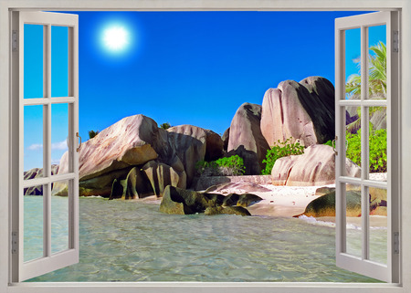Open window view to  old stones coastline Seychellesの写真素材