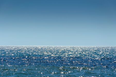 landscape view of the open blue sea blue sky. sparkling reflections of waterの写真素材