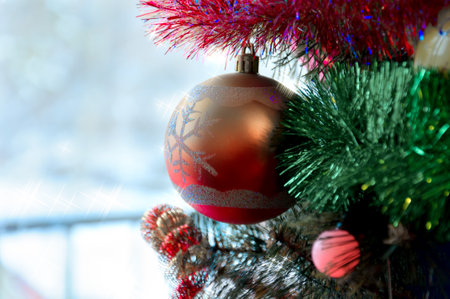 Christmas tree background and Christmas decorations with snow, blurred, sparking, glowing. Happy New Year and Xmas themeの写真素材