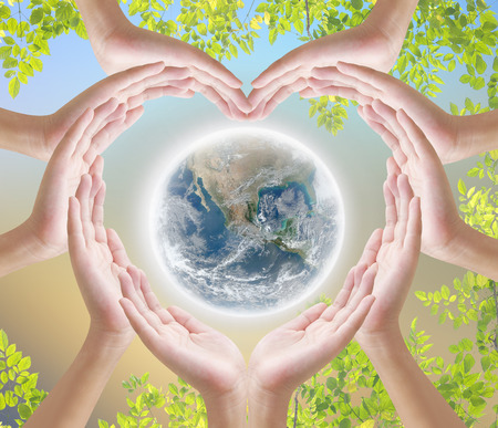 Hand heart shape on dark backgrroundの写真素材