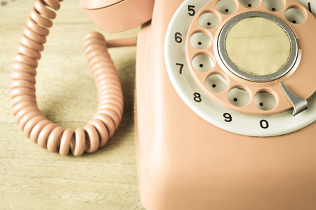 Close up Phone vintage on wood tableの写真素材