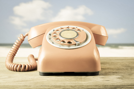 Phone vintage on sea backgroundの写真素材