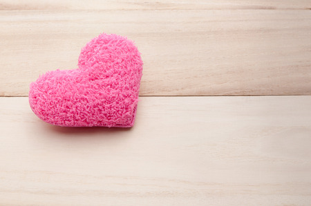 Pink heart on wood , holiday valentines backgroundの写真素材