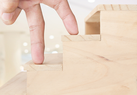 Finger walking up on stairs , ideas conceptの写真素材