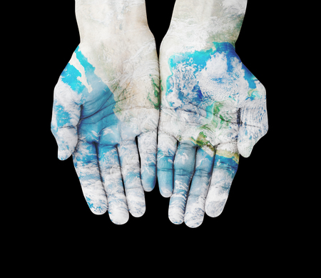 Man hands on earth , with clipping pathの写真素材