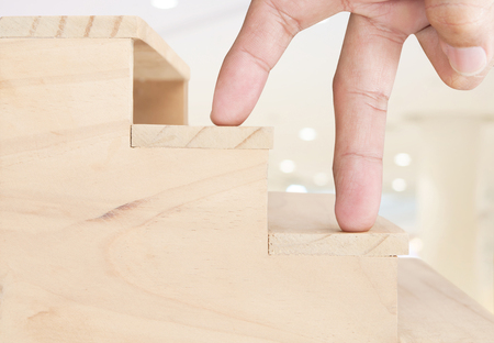 Finger walking up on stairs , ideas conceptの写真素材