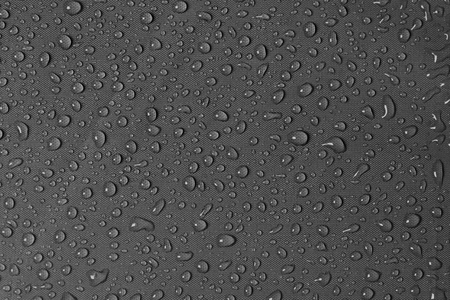 Water drop of rain on umbrella grey fabric art abstract backgroundの写真素材