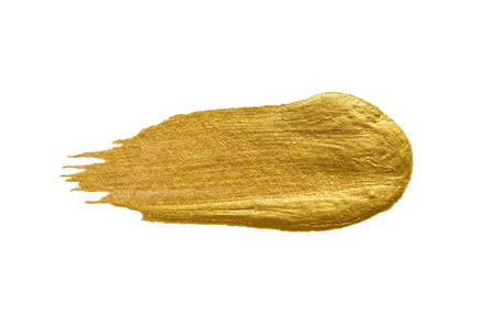 Gold acrylic paint texture on white paper backgroundの写真素材