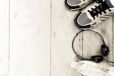 Sport shoes,sneaker and bottle of water on wooden background ,sport equipment top viewの写真素材