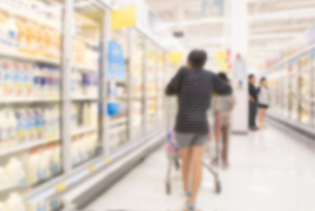 Blurred background women and people shopping in supermarket department storeの写真素材